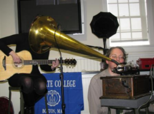 Courtesy: CBS Interactive Suzanne Vega sings into the apparatus as museum curator Gerald Fabris observes