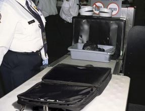 airport scanner with laptop flat in the case