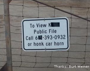Sign on a fence at a station