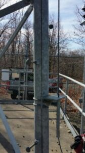 Image showing clogged weep hole in broadcast tower leg that can cause a split